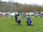 FZ013180 Black and blue knights fighting below Glastonbury Tor.jpg